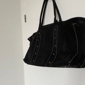Sac de week-end en cuir véritable noir surpiqué et boutons or bronze